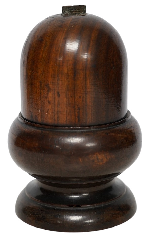 A Lignum Vitae storage vessel with a cutter / blade surmounted on the cover, possibly for cutting and storing spices, 18cm high. Condition - fair to good